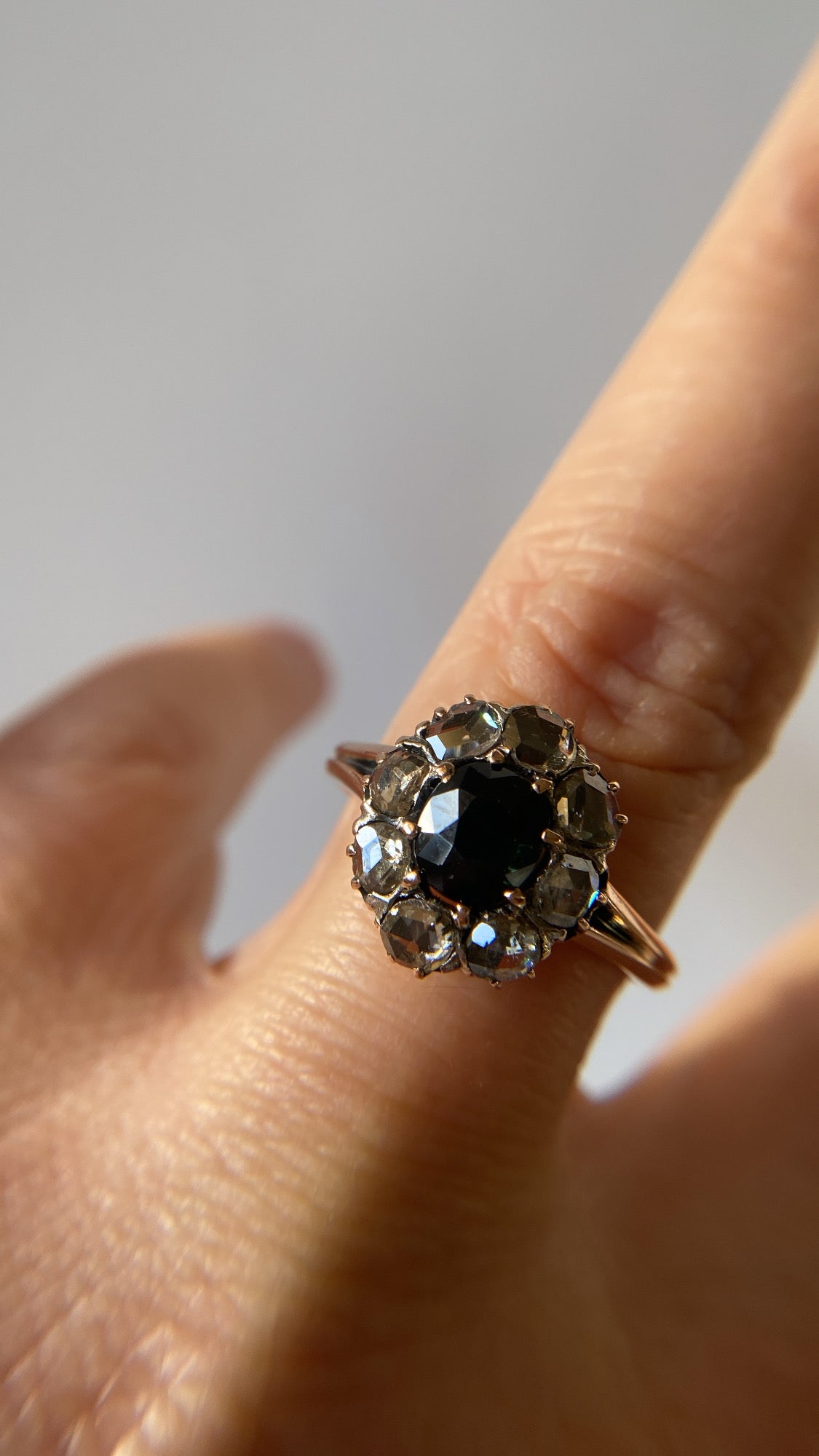 the teal green sapphire and rosecut diamond cluster