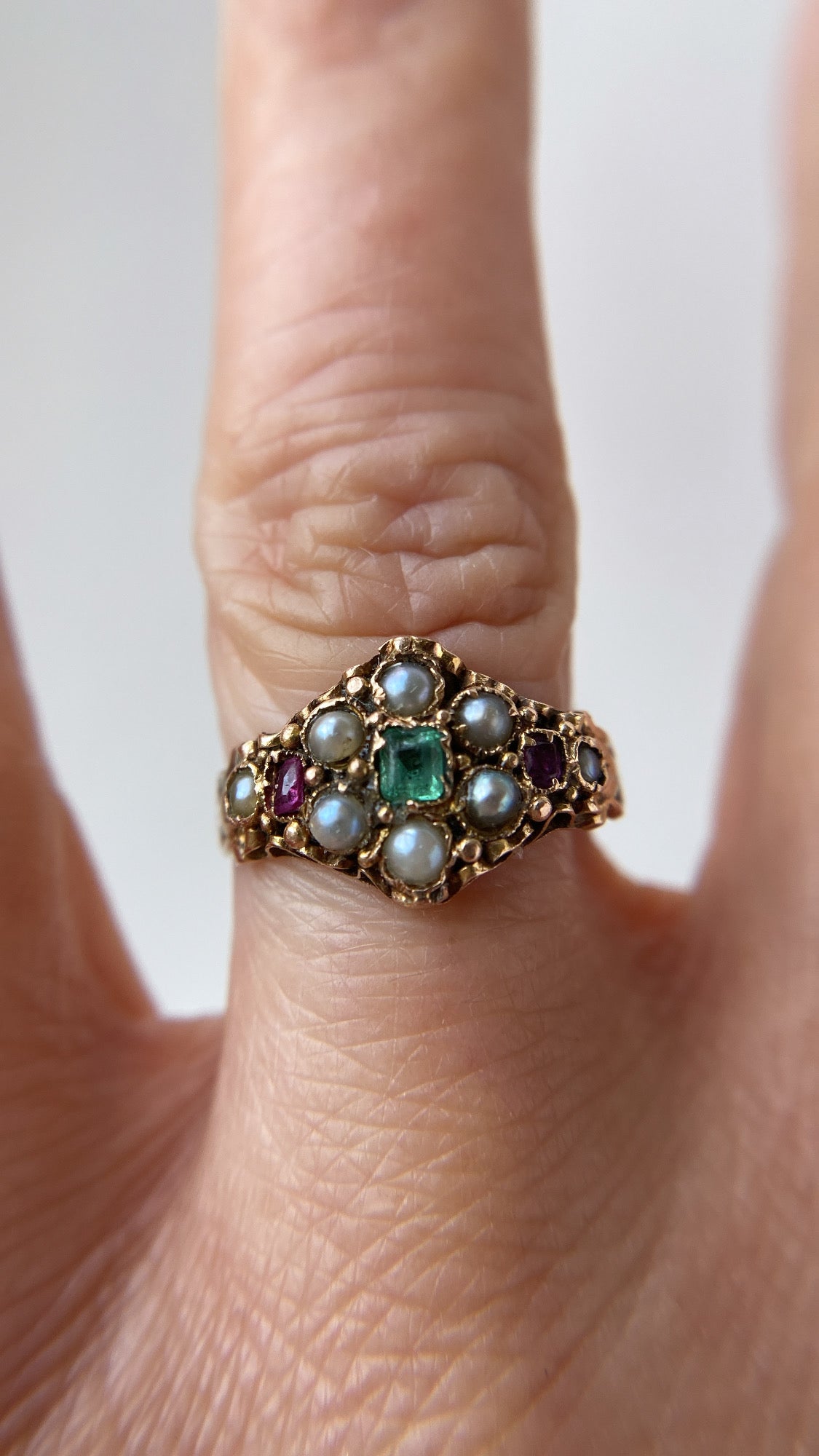 the ruby, pearl and emerald flower cluster