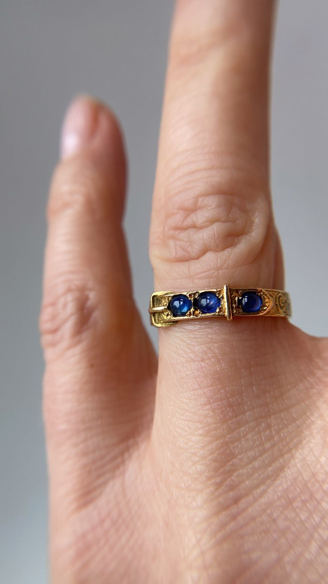 the sapphire buckle ring