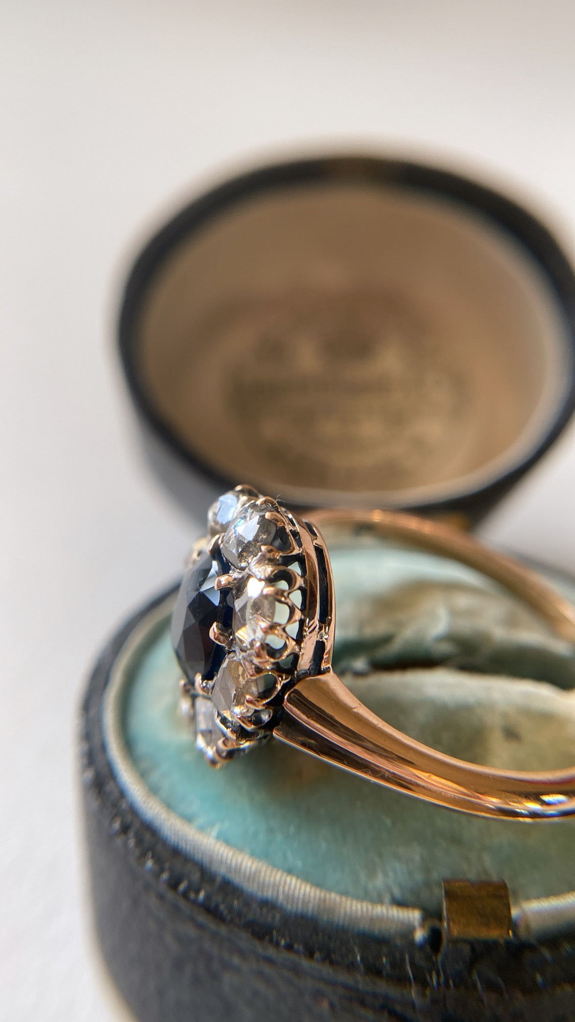 the teal green sapphire and rosecut diamond cluster