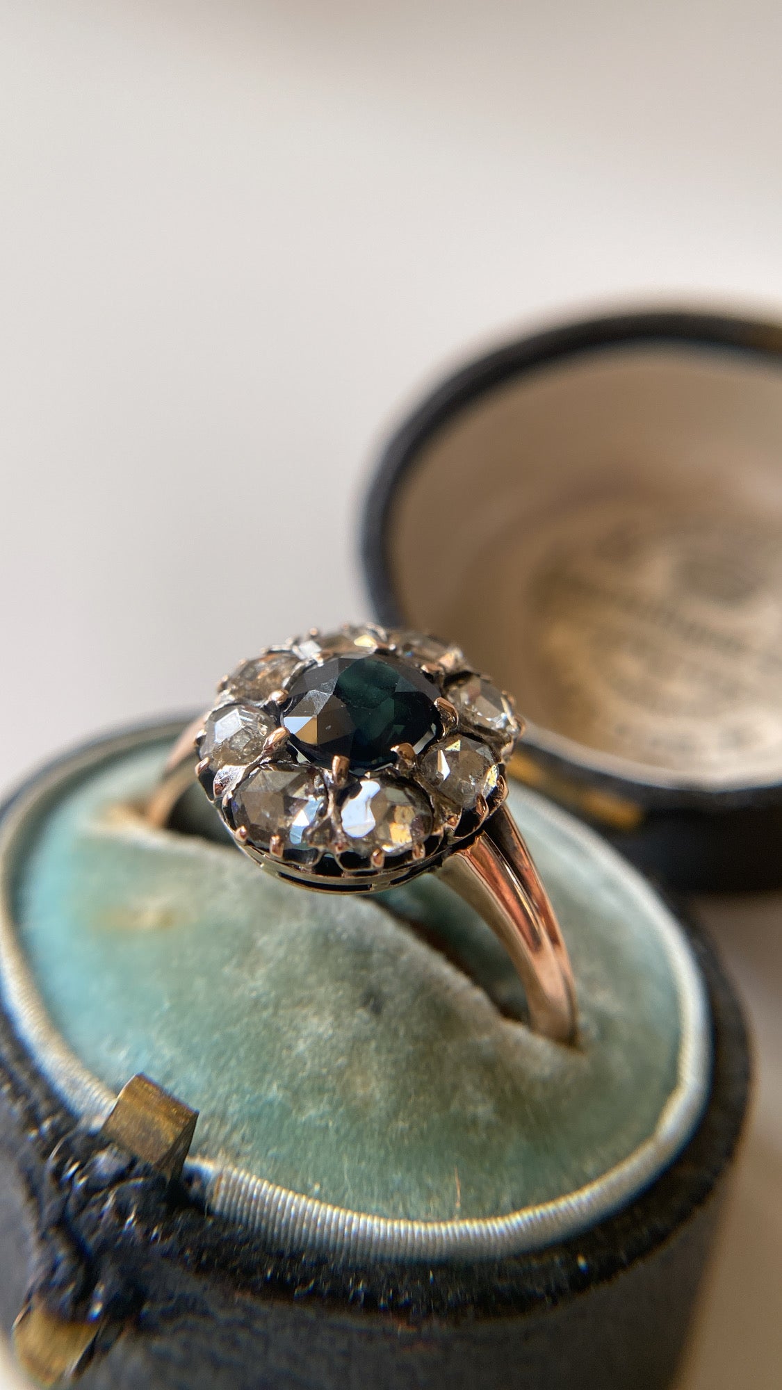 the teal green sapphire and rosecut diamond cluster