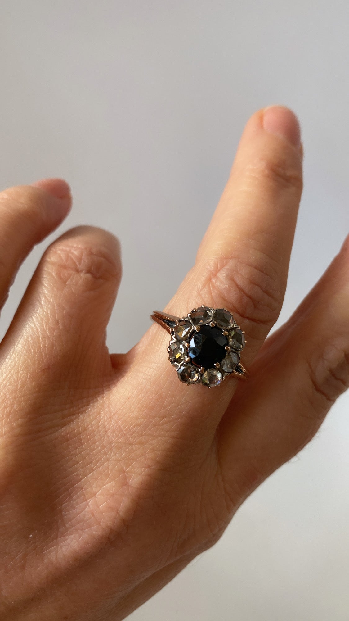 the teal green sapphire and rosecut diamond cluster