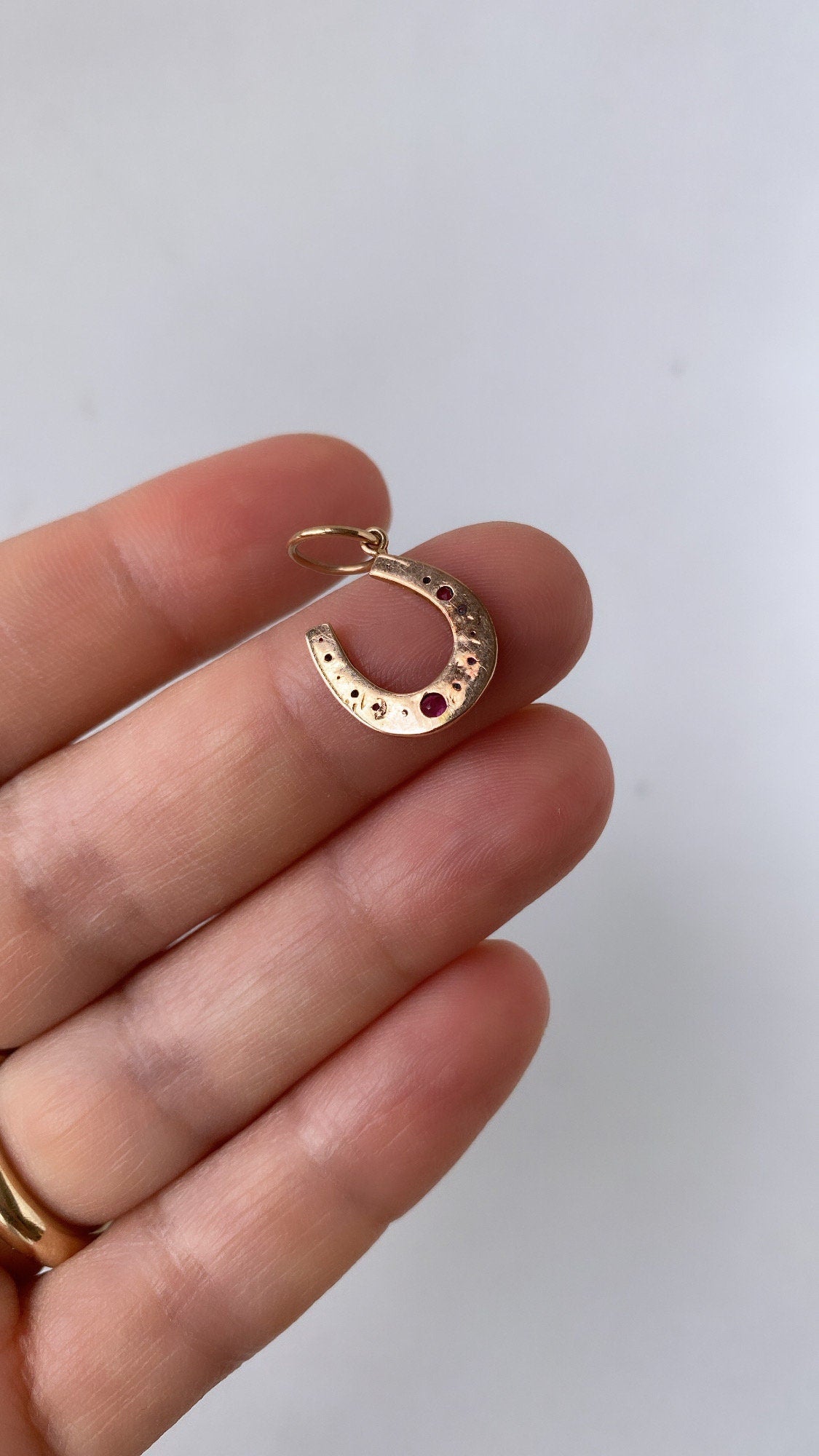 antique ruby lucky horseshoe charm