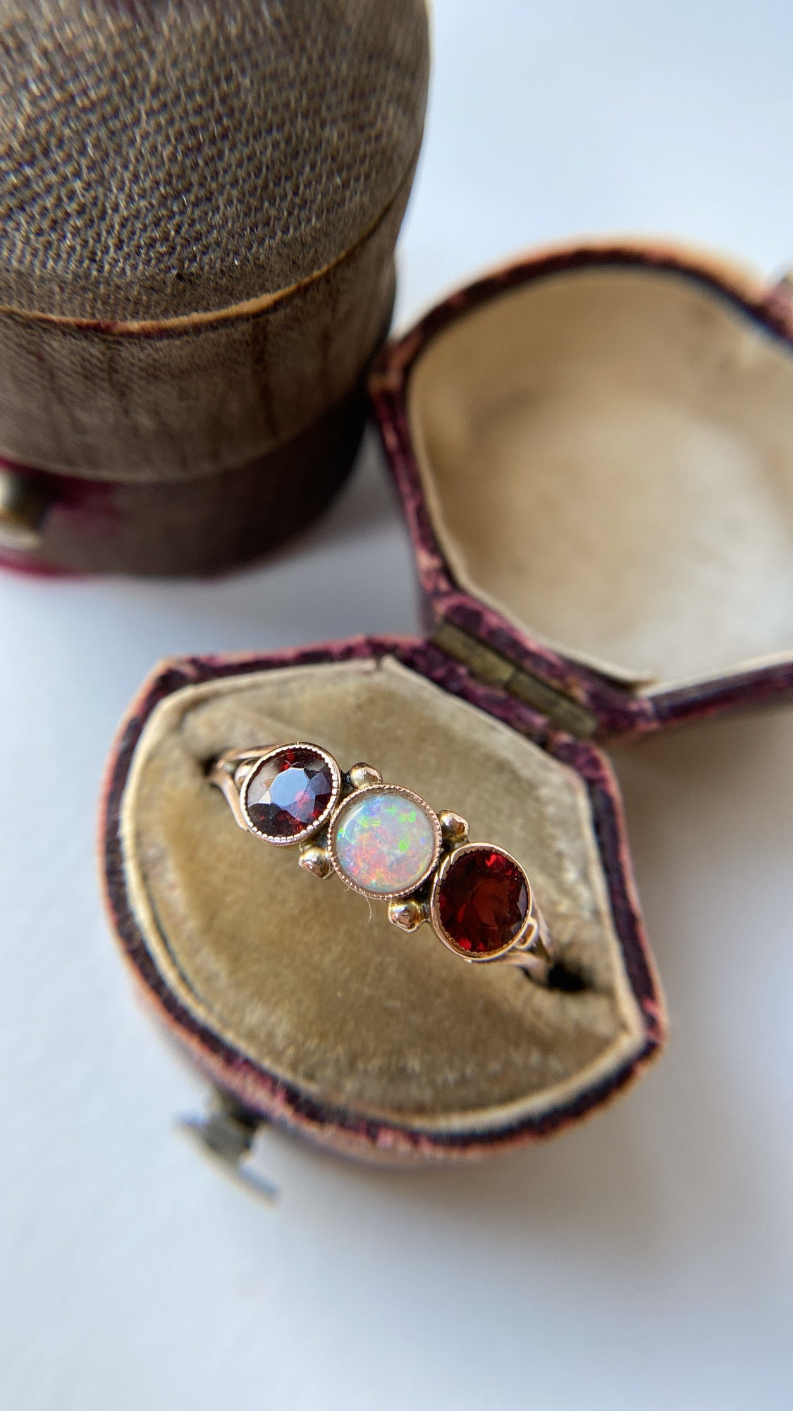 the opal and garnet three stone