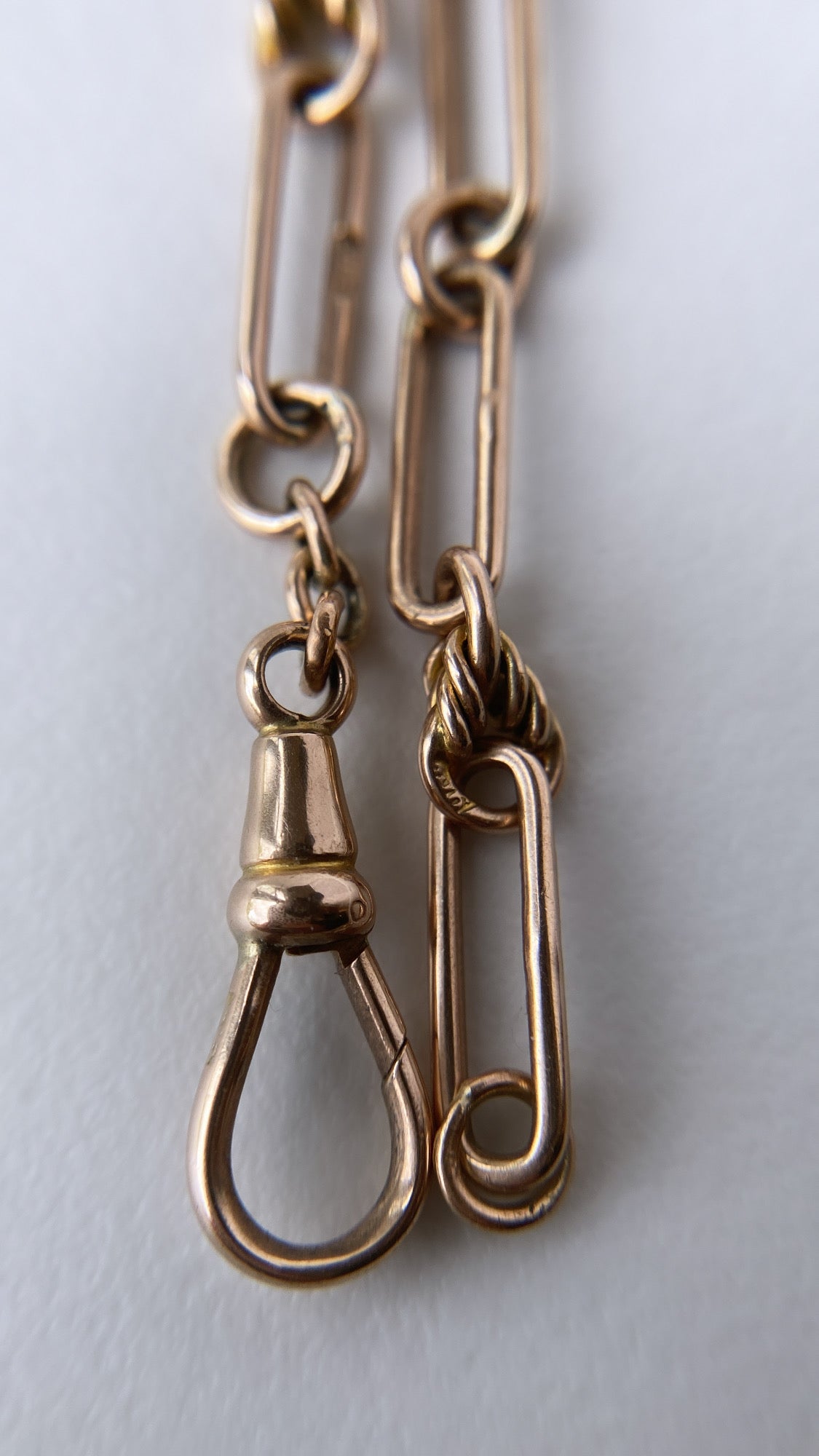 antique fancy link knot and trombone chain