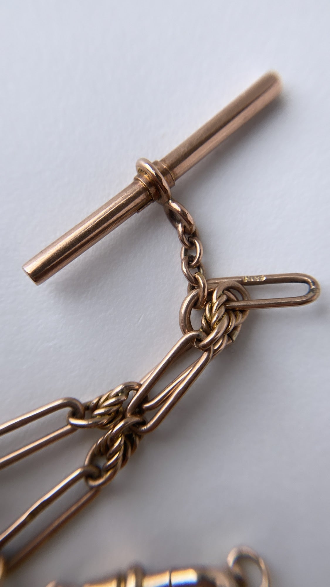 antique fancy link knot and trombone chain