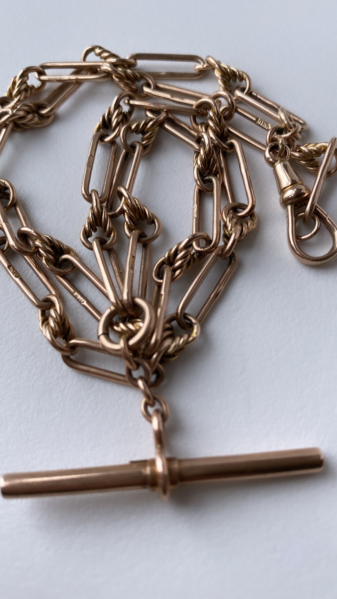 antique fancy link knot and trombone chain