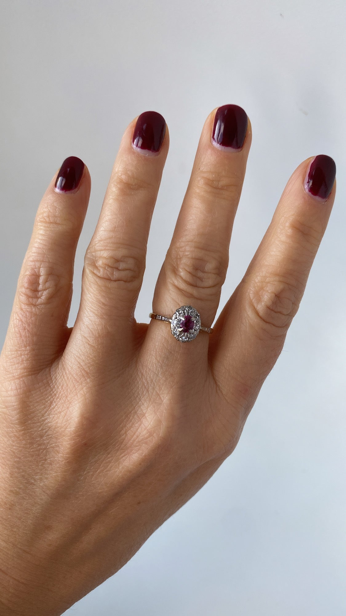 the sweet ruby and diamond halo ring