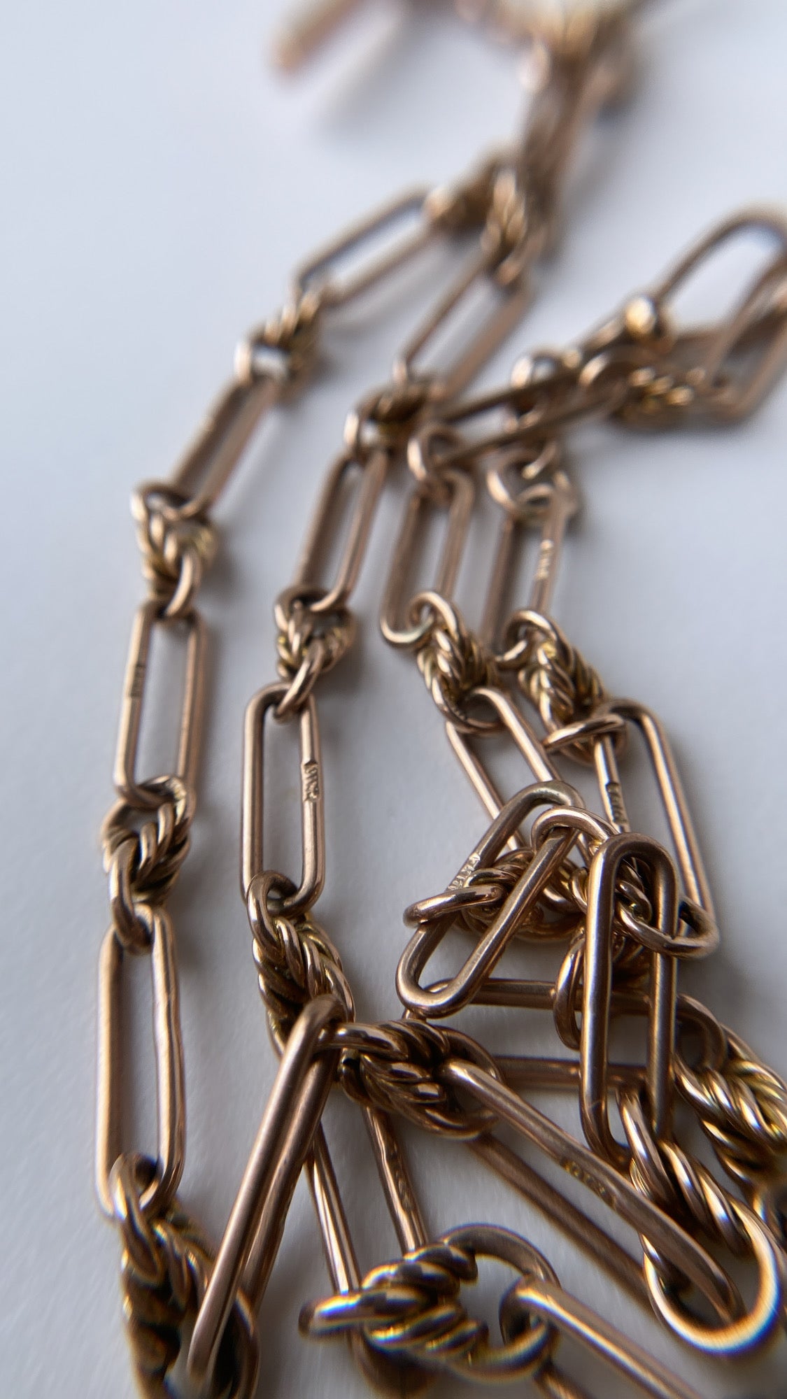 antique fancy link knot and trombone chain