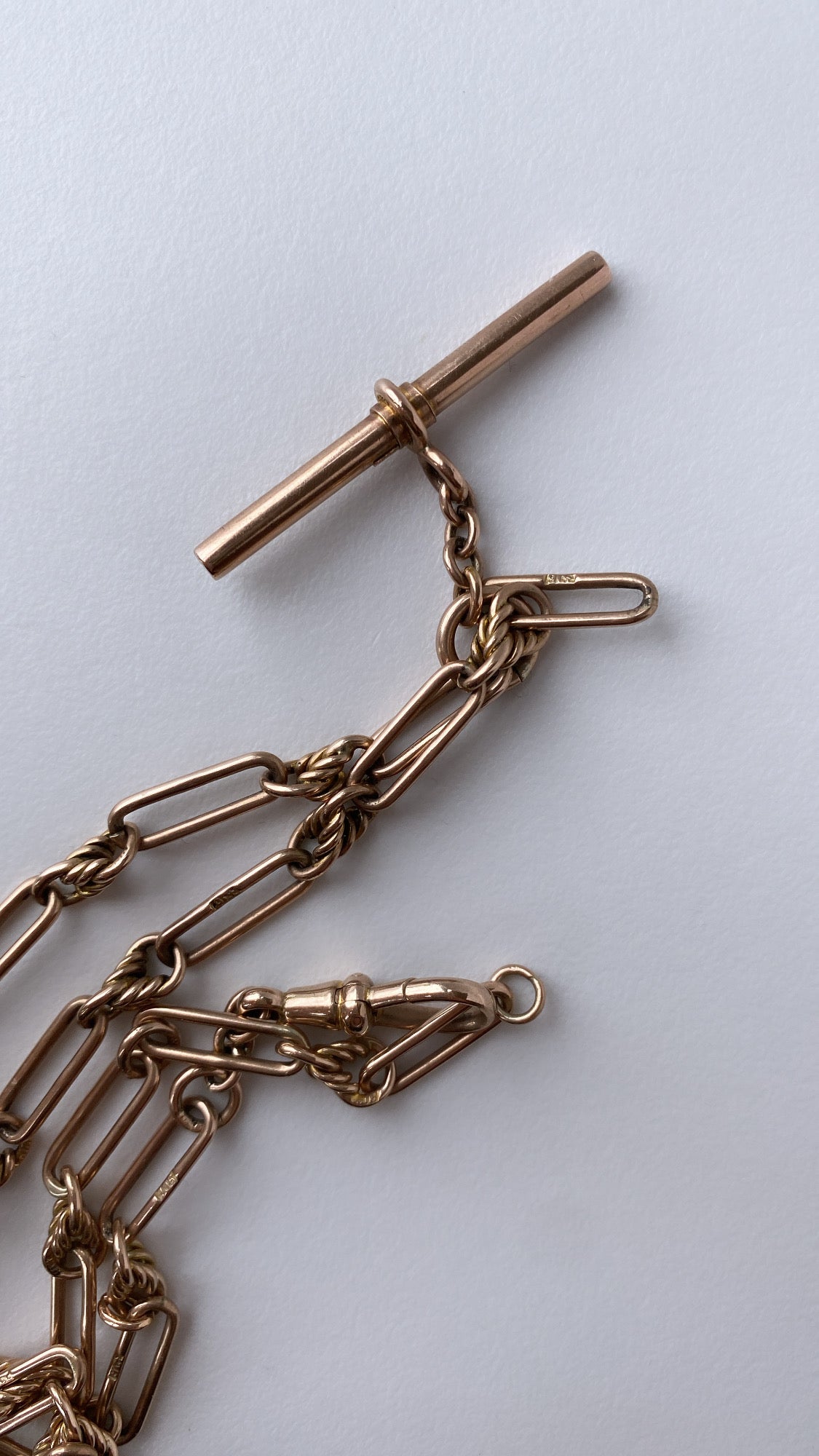 antique fancy link knot and trombone chain