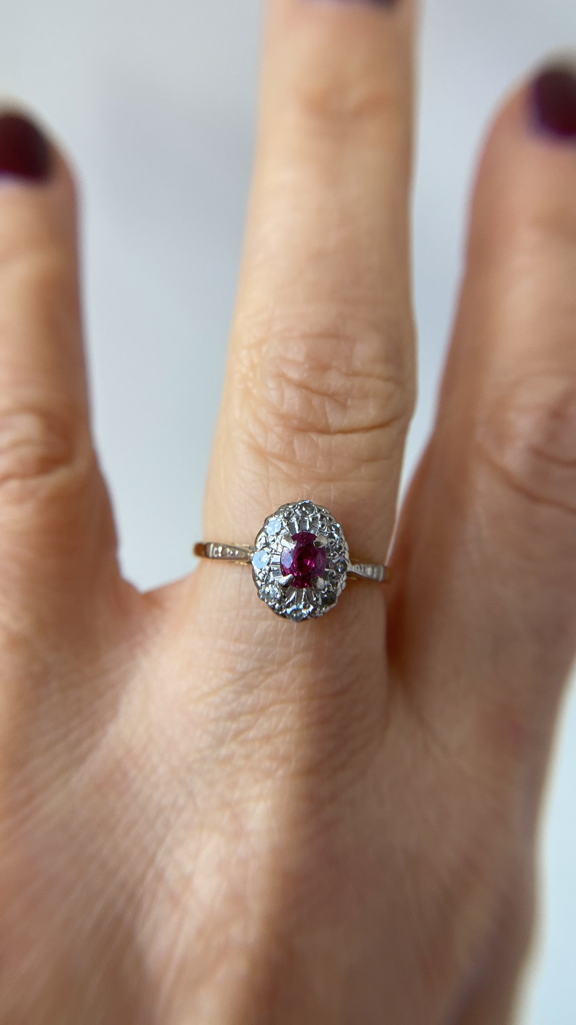 the sweet ruby and diamond halo ring