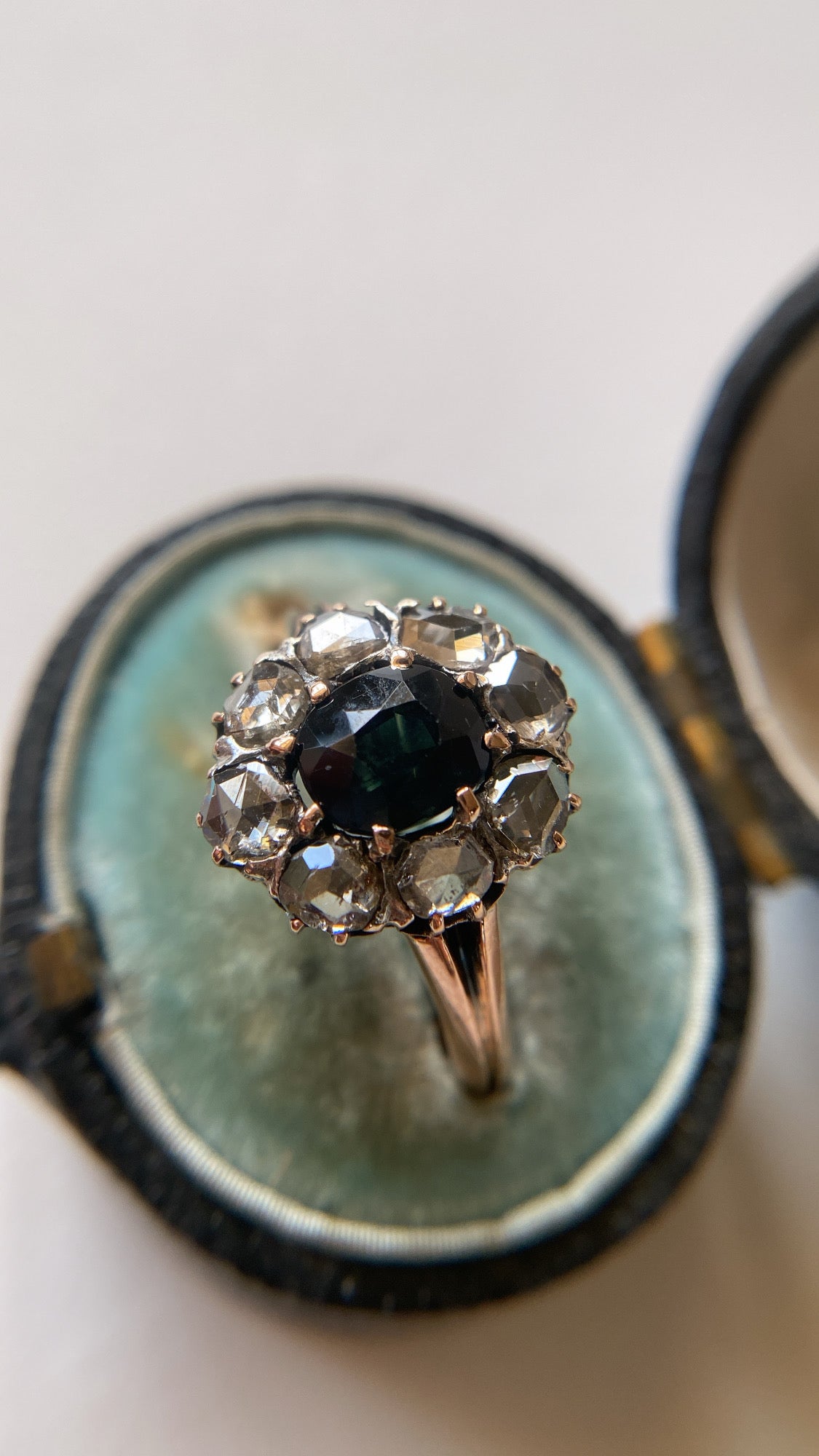 the teal green sapphire and rosecut diamond cluster