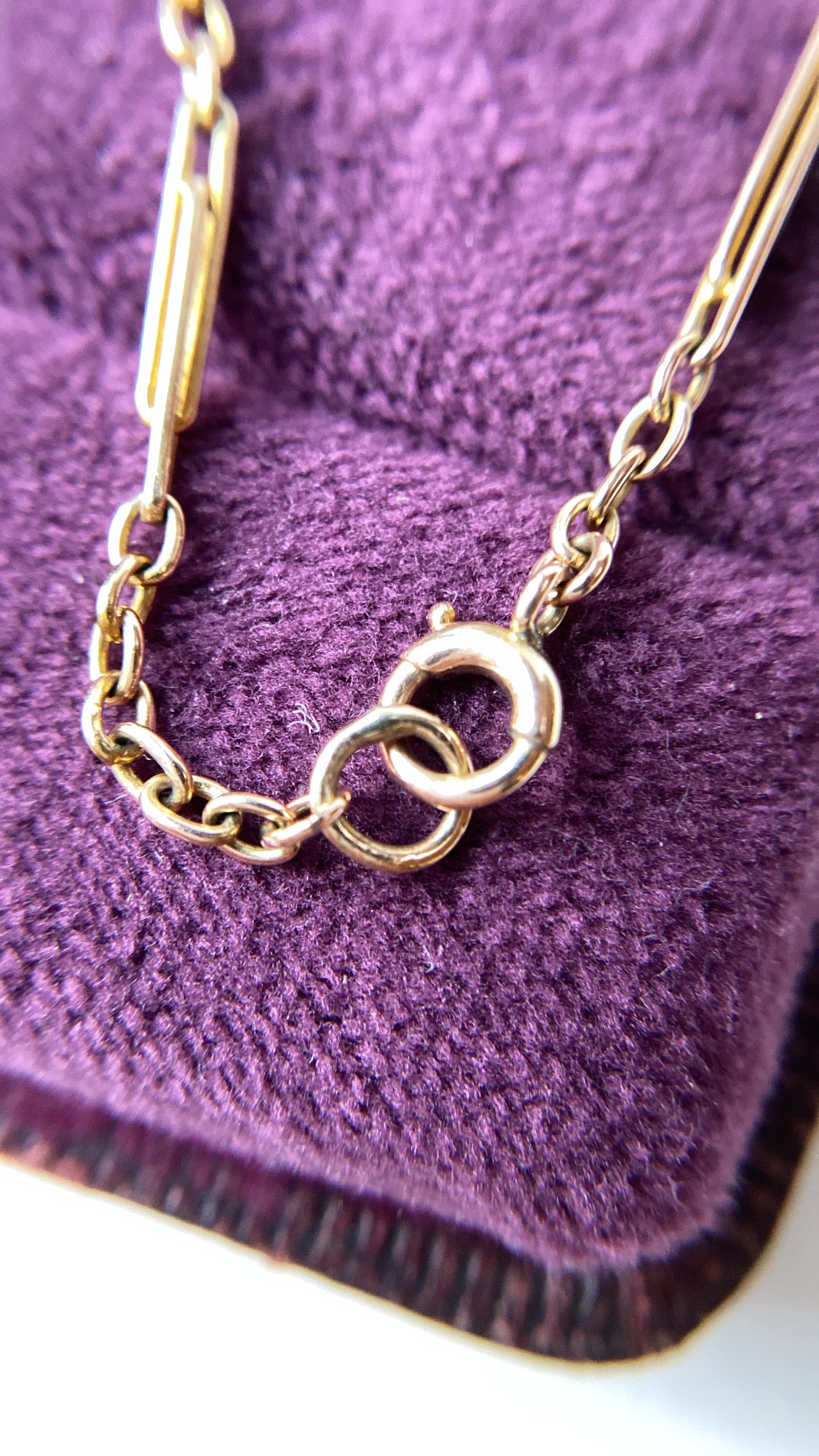 antique baby trombone and cable link chain