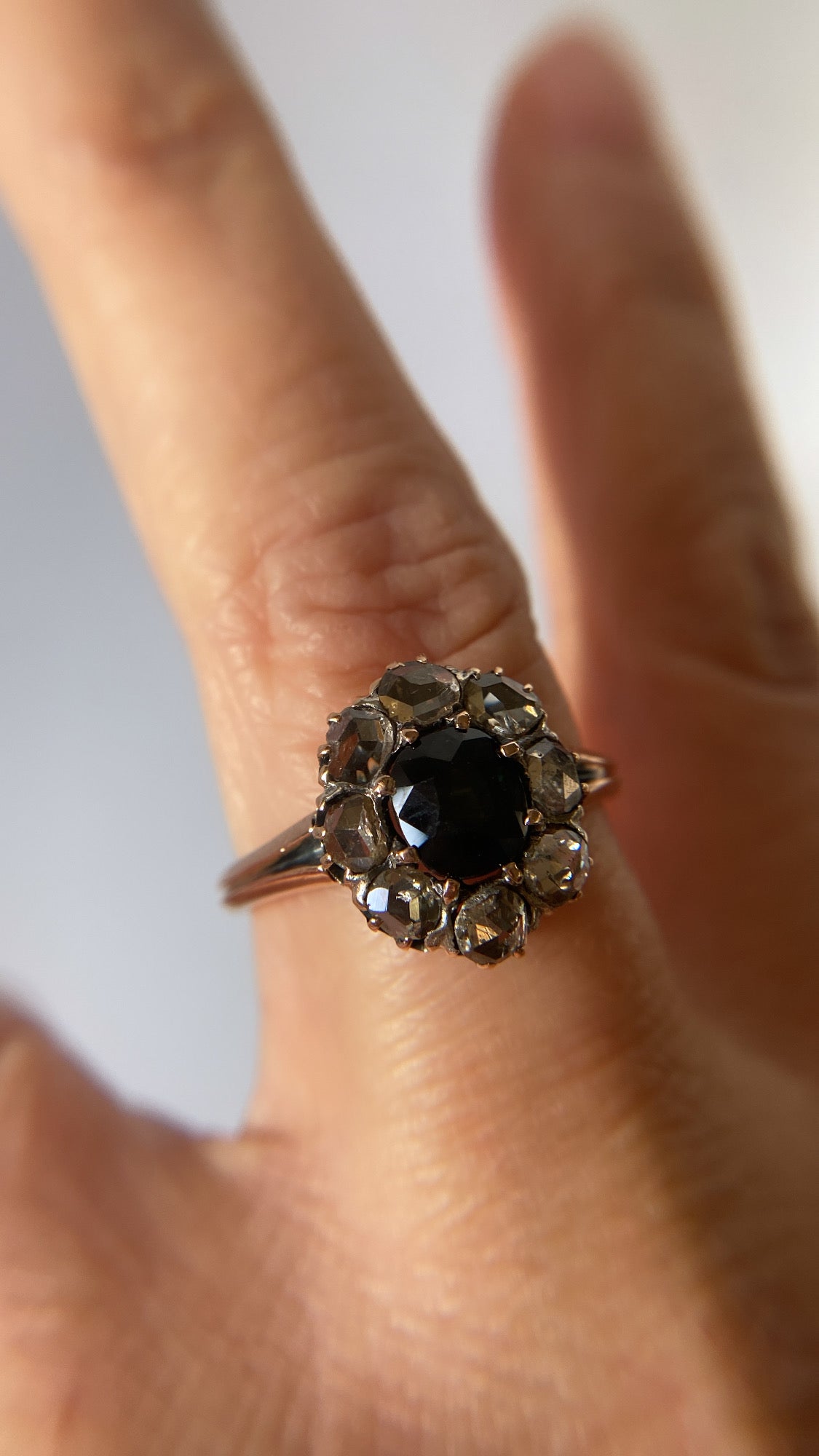 the teal green sapphire and rosecut diamond cluster