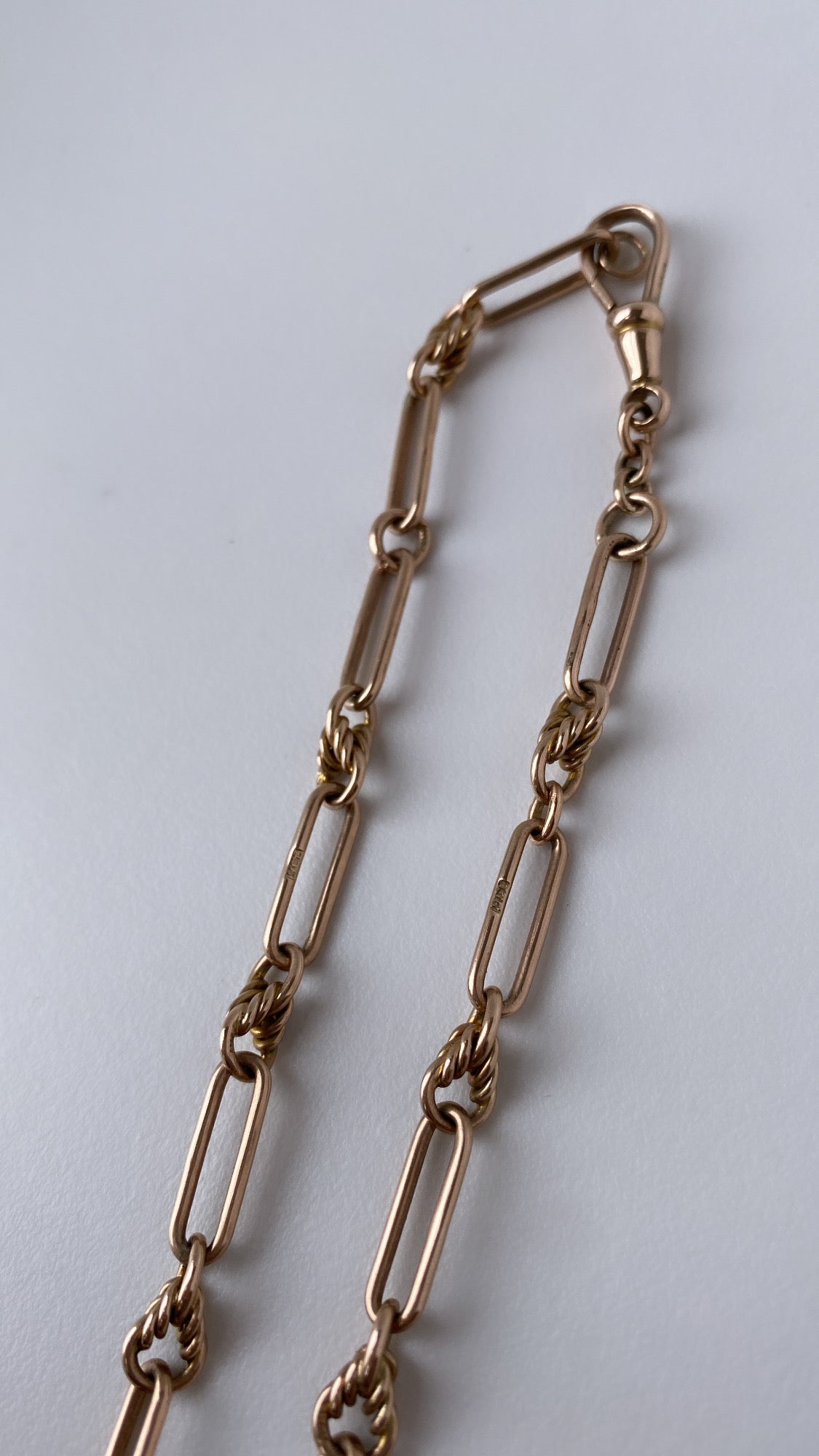 antique fancy link knot and trombone chain