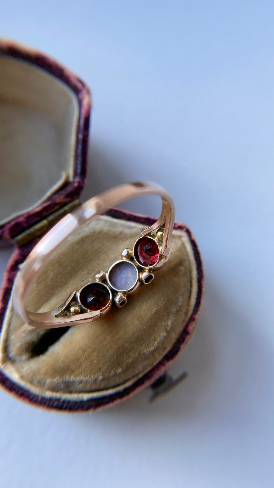 the opal and garnet three stone