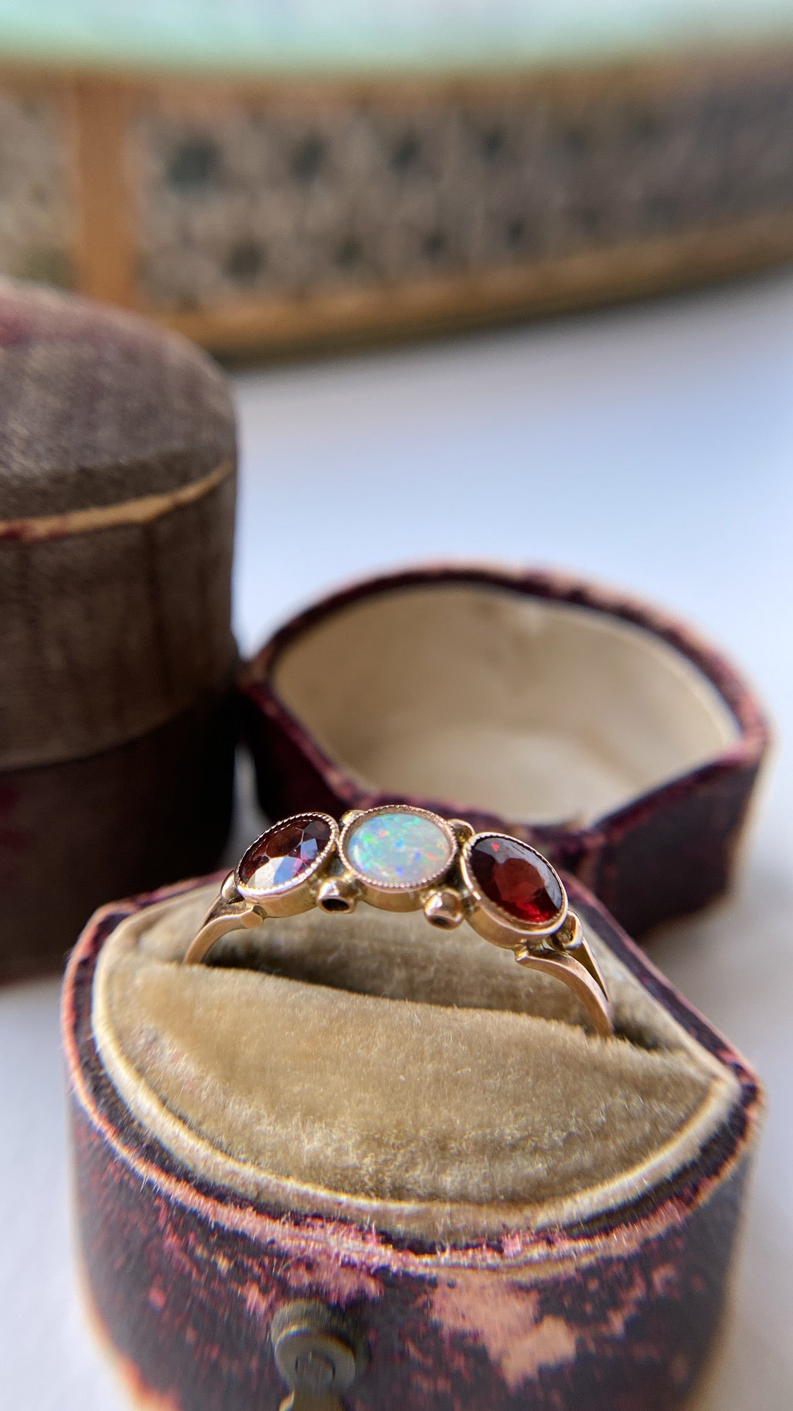 the opal and garnet three stone