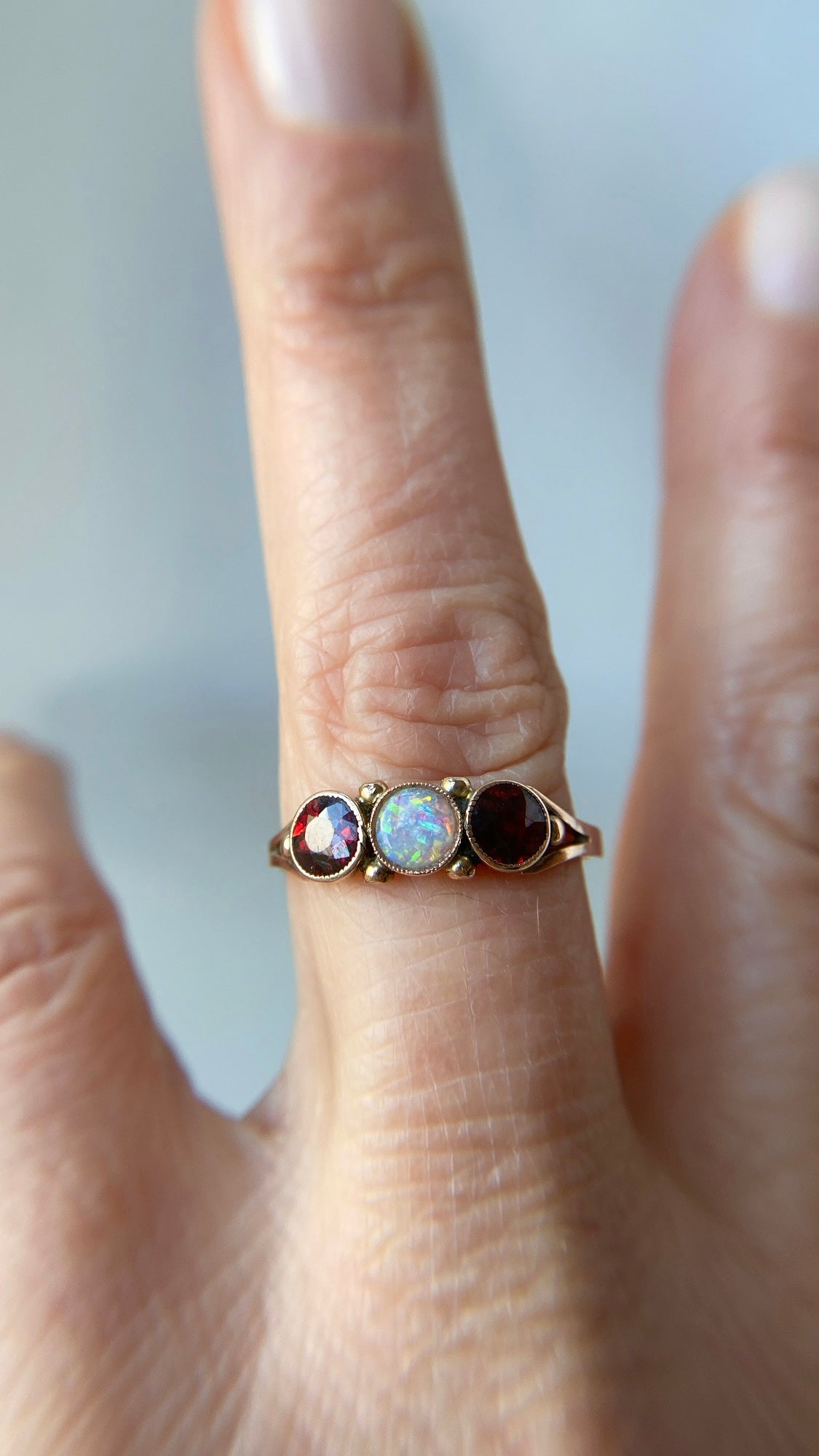 the opal and garnet three stone